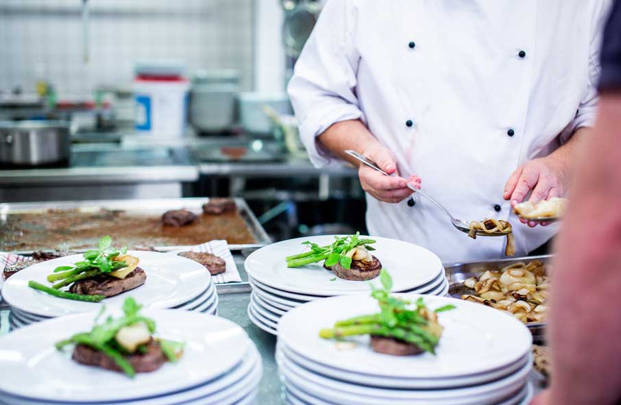 Chef Plating Up Meals